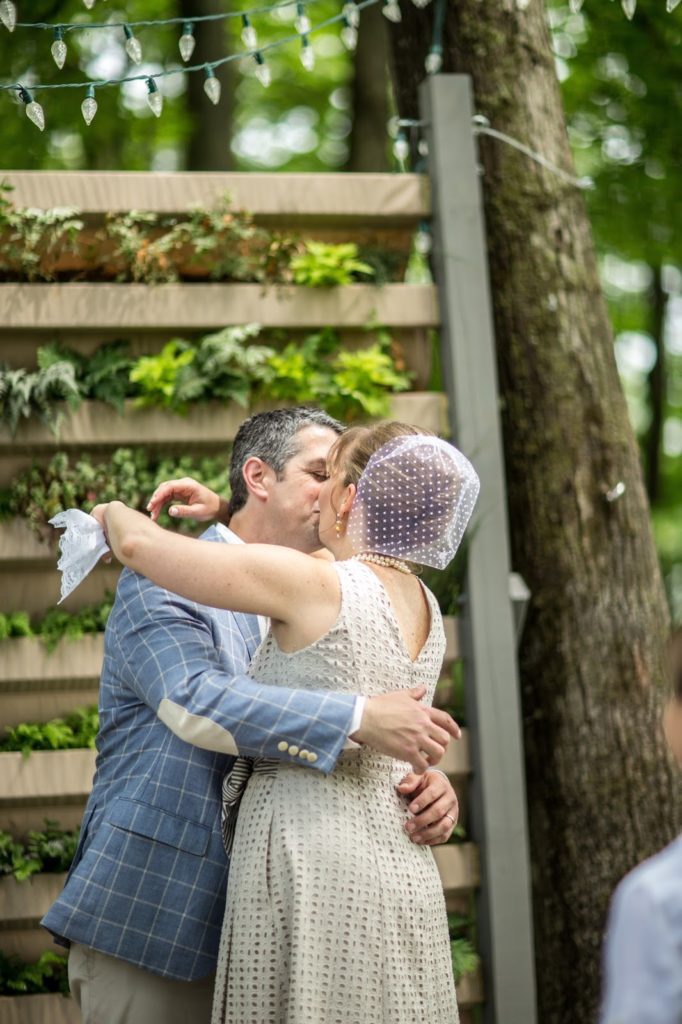 Heather + Nathan, Family Vow Renewal with Kissing on the Lips 27 20th anniversary kiss Alisa Tongg Celebrant Family Vow Renewal at The Living Wall at Promise Ridge Jeremie Barlow Photography